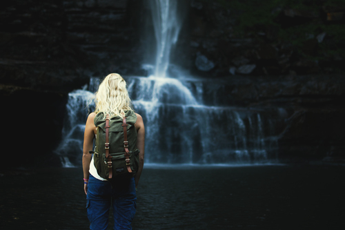 Blond girl and waterfall
