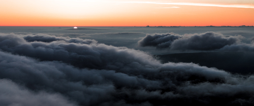 Sunrise above clouds