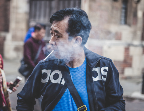 Man in cigarette smoke