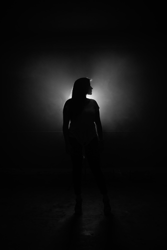 Girl in front of light