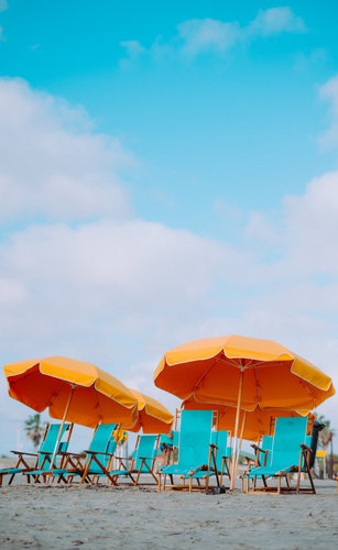 Yellow umbrellas and blue chairs