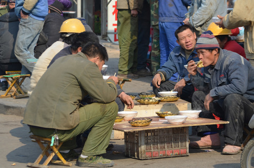 Workers eating on lunch break