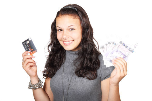 Woman with credit card and money