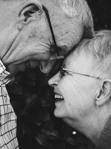 Old couple laughing