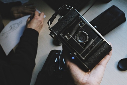 Strut-folding camera