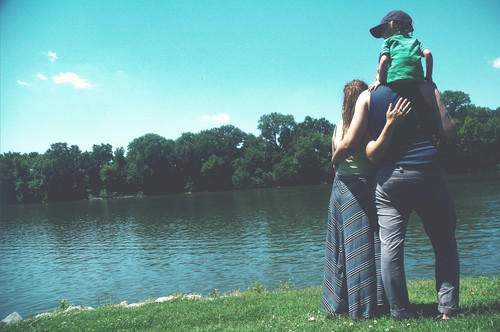 Family enjoying lovely day by the water