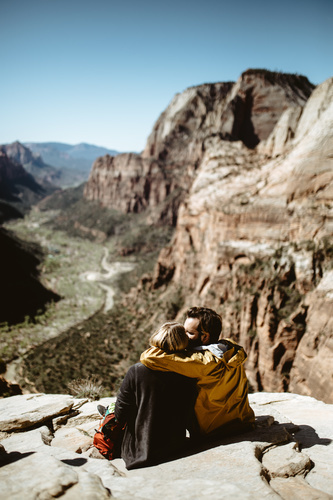 Couple hugging on hill top