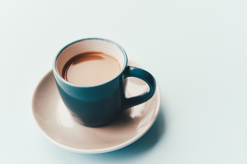 White coffee in blue mug