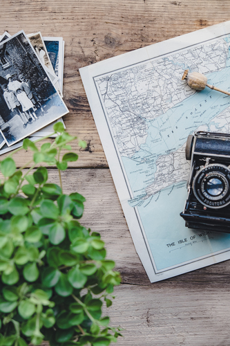 Photos, map, camera on table