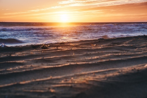 Wavy sea and sunset