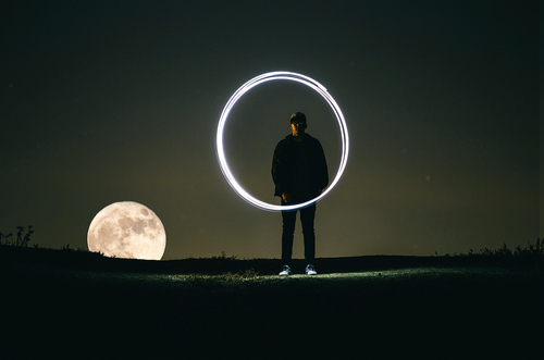 Man with the Moon in the background