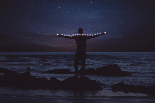 Man on a rock by the sea