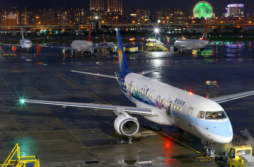 Passenger airplanes at airport at night