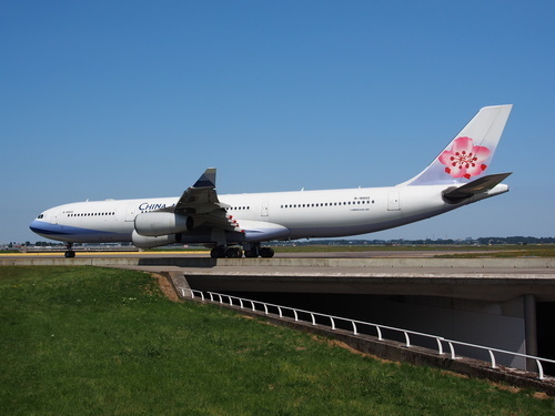 Airplane of China Airlines taxiiing on the airport