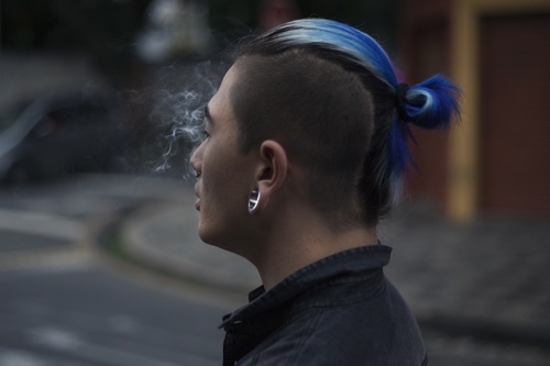 Blue bun with shaved head