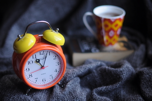 Book, coffee and clock