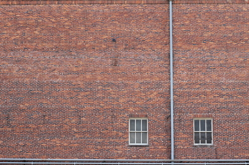 Brickwork and two windows from old building
