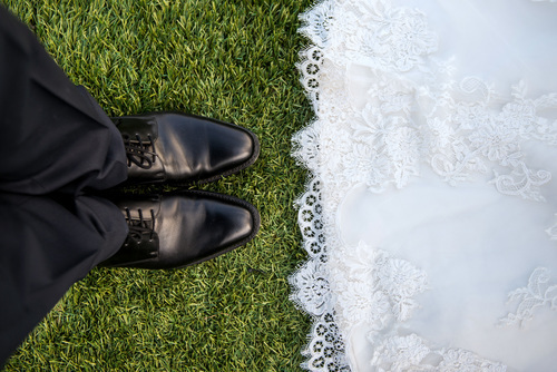 Bride and groom on grass