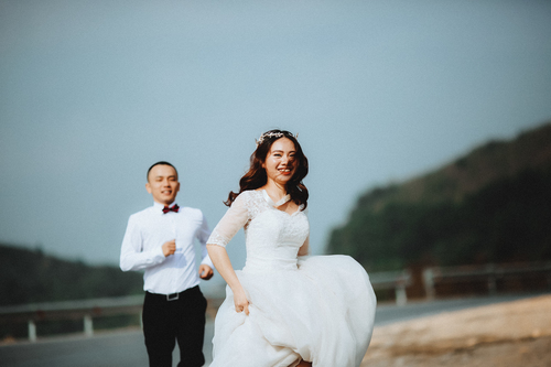 Bride running from groom