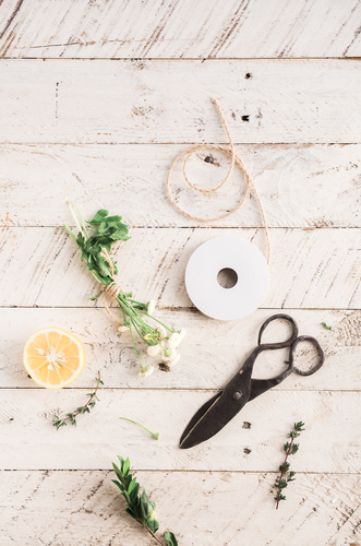 Herbs, lemon and scissors