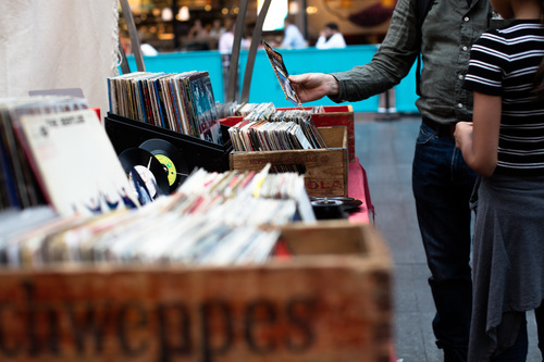Browsing vinyl music at a fair