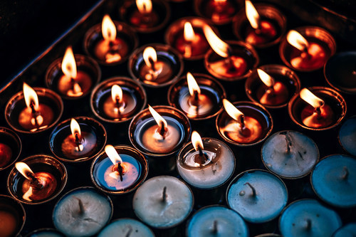 Burning prayer candles