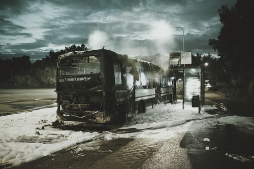 Burned down bus in snow