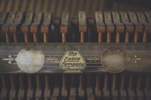 Cable Company logo and musical instrument