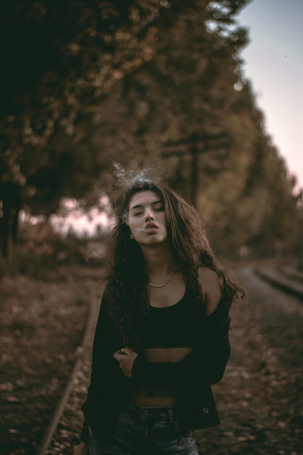 Girl breathing out smoke