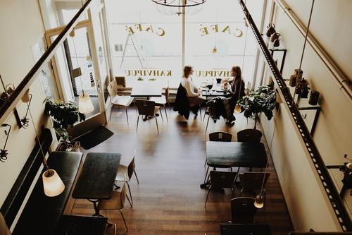 Two girls sitting in a cafe