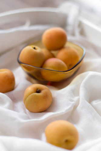 Apricots in and out of bowl