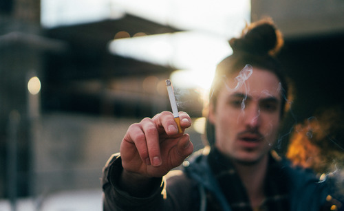 Man smoking a cig
