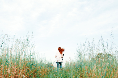 Ginger-haired girl in nature