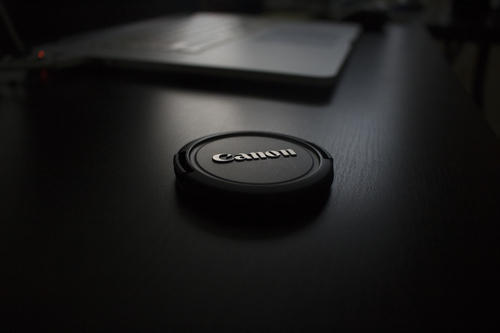 Canon lens cap on the table