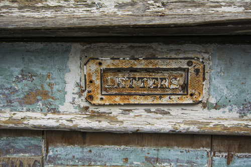 Rusty logo on a wooden background