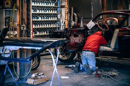 Man restoring a car