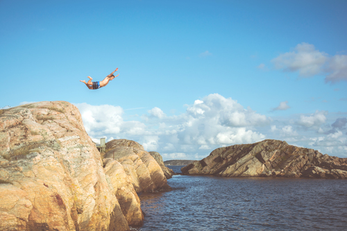 Man jumping from a cliff