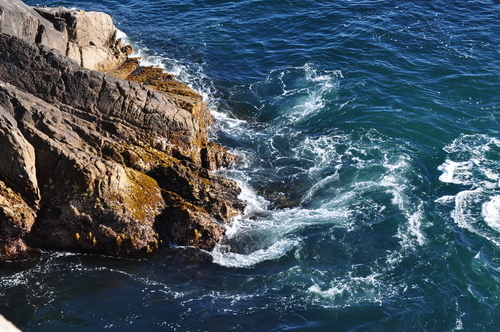 Splashing sea water on the rocks