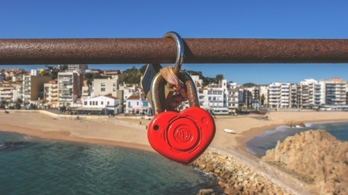 Heart lock above the beach