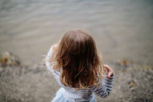 Girl in front of water