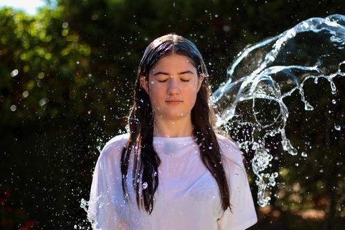 Girl splashed with water