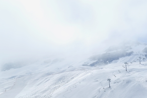 Chairlift on foggy mountain