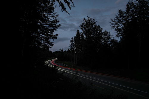 Road in the dark with some car lights