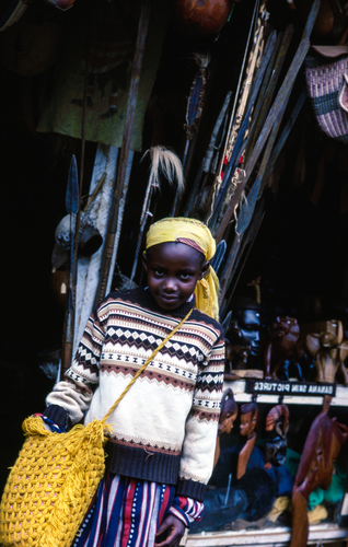 Child by market stall