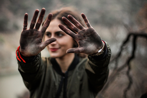 Girl with dirty palms