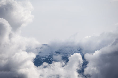 Clouds surround a mountain