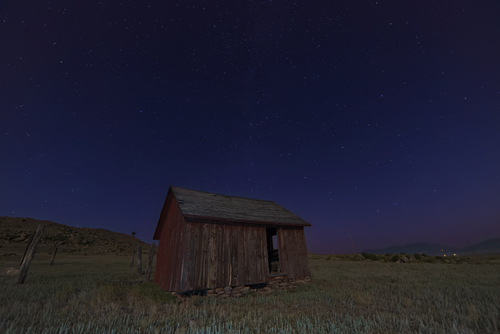 Rustic cabin in the field