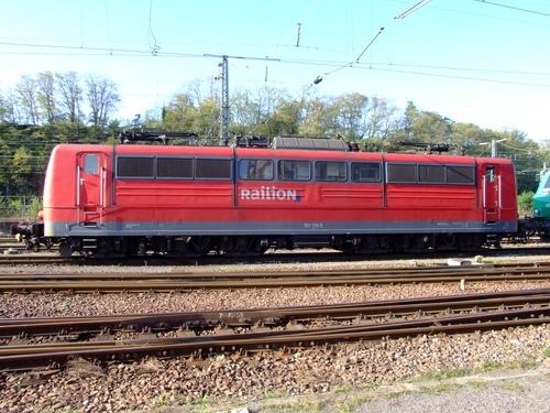 Red locomotive on the rails