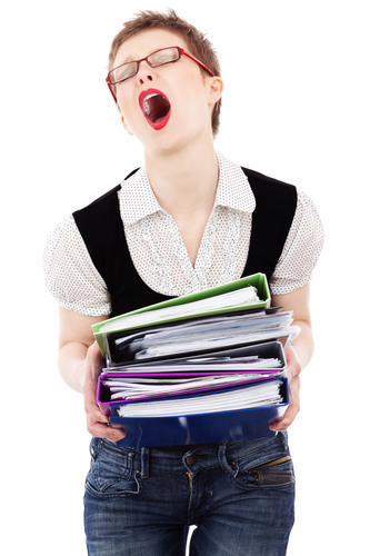 Woman holding papers stack