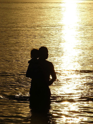 Silhouette of father and daughter